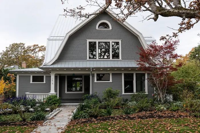 Professional painter working on Campbell River home exterior